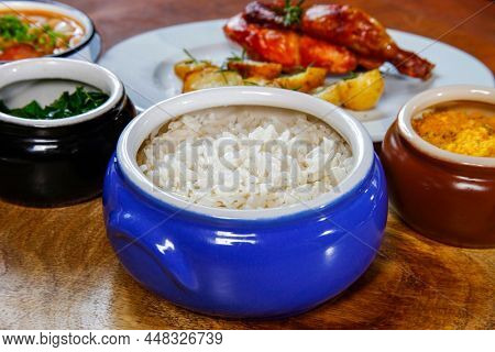 Traditional cooked white rice in Brazilian food, tutu, feijao