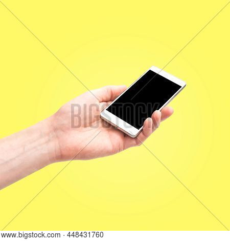 Hand Holdi Smartphone  Empty Screen Isolated On Yellow Background