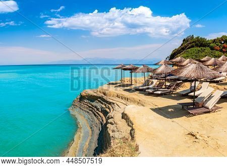 Canal Damour Or Love Channel In Sidari, Corfu Island In Greece. Damour Beach With Umbrellas And Sun 