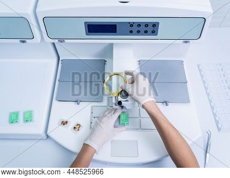 Laboratory Assistant Works At Paraffin Wax Dispenser Tissue Embedding Machine.