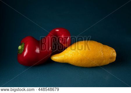 Concept - Food Waste Reduction. Using In Cooking Imperfect Products.  Ugly Red Pepper And Elongated 