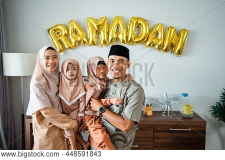 Beautiful Muslim Family Portrait Together Smiling To Camera