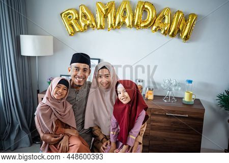 Beautiful Muslim Family Portrait Together Smiling To Camera