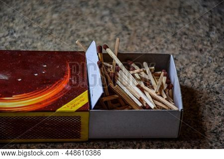 Stock Photo Of Half Open Match Box With Large Numbers Of Match Sticks Kept On Floor On Blur Backgrou