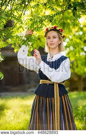 Latvian Woman In Traditional Clothing. Ligo Folk.