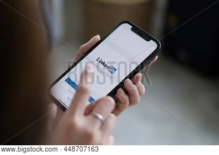Chiang Mai, Thailand - Feb 03, 2022: Woman Holding Phone With Linkedin Application On The Screen. Li