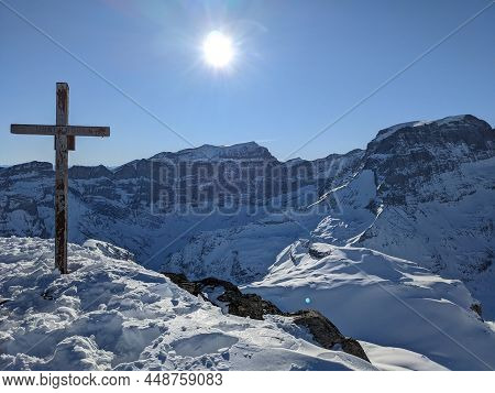 Summit Cross On The Gemsfairenstock And In The Background The Piz Russein. Day Of Ski Touring In The