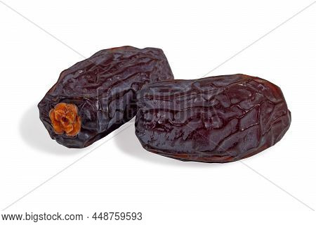 Dried Selected Dates Close-up. Isolate Of Two Fruits Dates On A White Background.