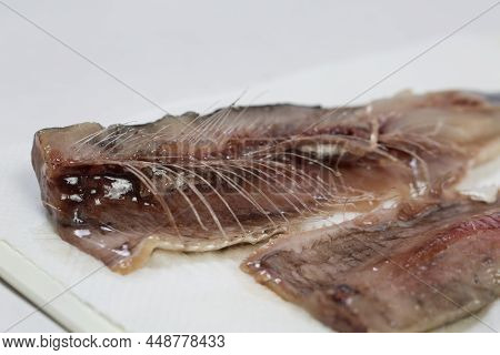 Meat And Bones Of Fresh Herring For A Delicious Dish, Carve Fish
