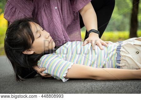 Sick Daughter Is Fainted And Fallen On Floor While Playing And Exercise,asian Mother Help,take Care,