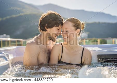 Portrait Of Young Carefree Happy Smiling Couple Relaxing At Hot Tub During Enjoying Happy Traveling 