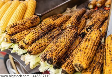 Misir, a popular street food for sale on a vendor track at Istanbul, Turkey. Misir is a freshly boiled or grilled sweet corn on the cob sprinkled with salt and spices