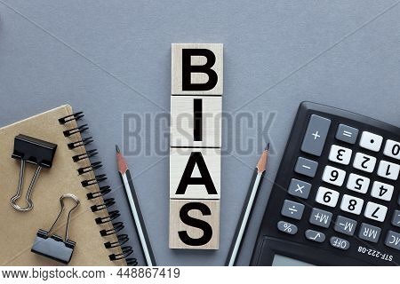Bias - Word From Wooden Blocks, Personal Opinions Prejudice Bias Concept. On A Gray Background.