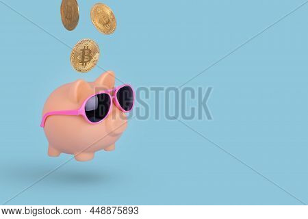 Creative Idea With Golden Bitcons And Piggy Bank Wearing Sunglasses Isolated On A Bright Blue Backgr