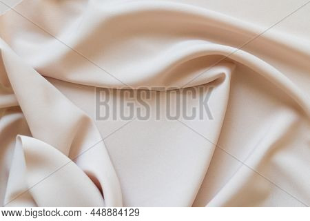 Abstract Beige Cloth Texture Background With Folds. Copy Space