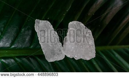 Crystal Clear Alum Cubes Or Potassium Alum On Green Leaf. Chemical Compound Substance. Concept For B