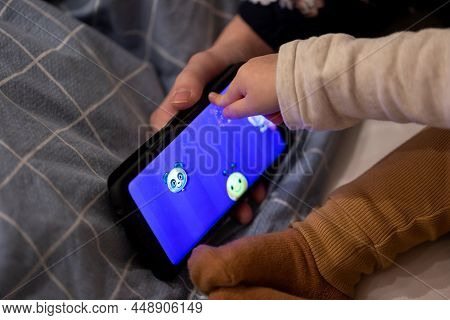 Brecht, Belgium - 7 November 2021: A Portrait Of The Hand Of An Adult Holding A Android Smartphone D