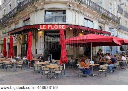 Sete, France - October 2, 2021: People Visit A Cafe In Downtown Sete, France. Sete Is A Famous Harbo