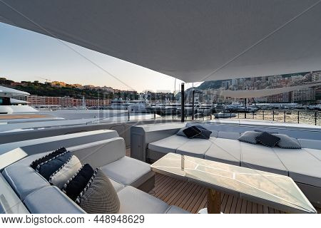 The Front Deck Of Huge Yacht In Port Of Monaco At Sunset, The Place For Landing Of Helicopter, A Lot