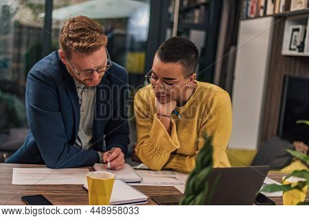 Two Diverse Natural Colleagues In Casual Office Or Home Office Doing Paperwork Working Together Teac