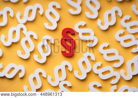 Red Paragraph Sign Surrounded With White Paragraph Sign On Yellow Background