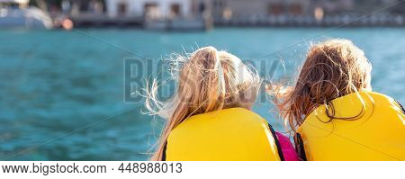 Back View Two Cute Little Blond Happy Excited Smiling Caucasian Girl Friends Wear Lifevest Enjoy Sai