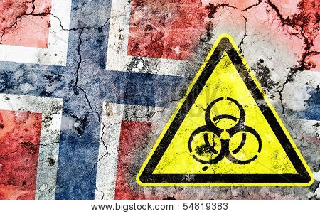 Old Cracked Wall With Biohazard Warning Sign And Painted Flag