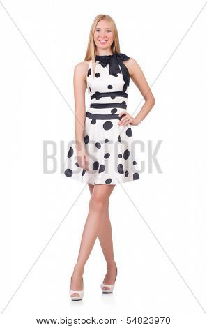 Tall model dressed in dress with polka dosts on white