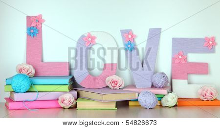 Shelf decorated with handmade knit letter