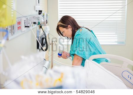 Pregnant woman in active labor using nitrous oxide gas