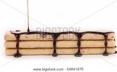 Stream chocolate on stics of biscuit.
