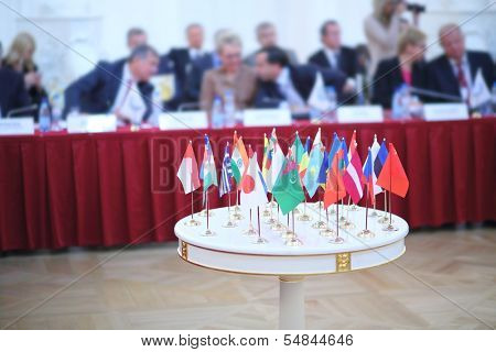 White table with 28 national flags at the International Congress of Industrialists and Entrepreneurs