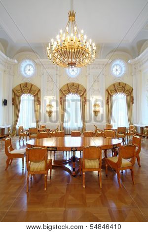 MOSCOW - OCT 10: A large round table in the luxurious living room in the Petroff Palace, on October 10, 2013 in Moscow, Russia. 