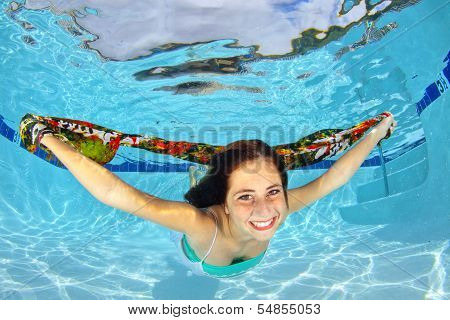 Girl Swimming Underwater With A Scarf
