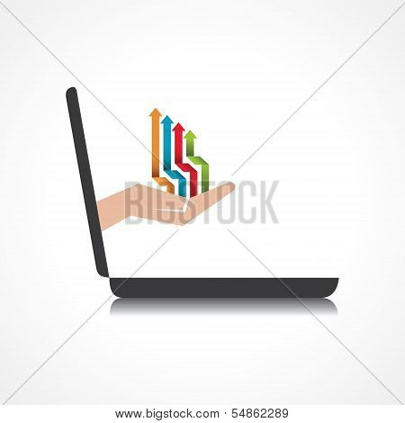 hand holding colorful arrows comes from laptop screen