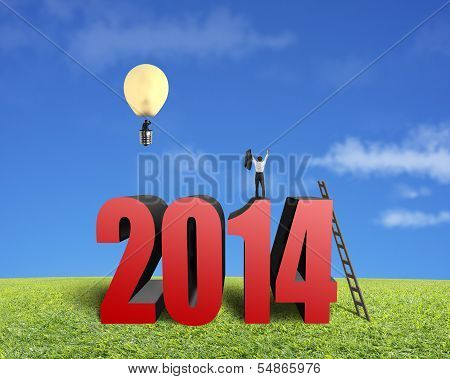 Businessman Standing On Top Of 2014, Another In Lamp Balloon