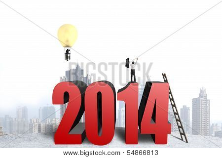 Businessman Standing On Top Of 2014 Structure, Another In Balloon