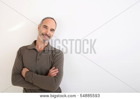 Portrait of 50-year-old man standing on white background