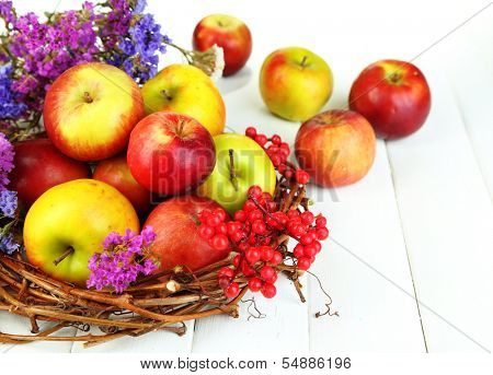 Juicy apples on white wooden table