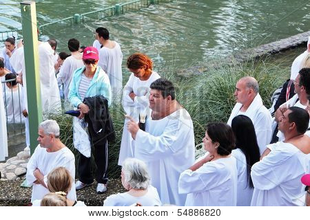 Yardenit, Israel - January 21: Baptism of Christian pilgrims in the holy waters of the Jordan River in the days of the Feast of Holy Baptism 21 January 2012 at Pilgrim baptismal site Yardenit, Israel