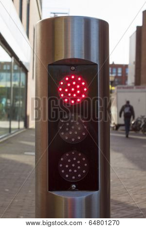 Red Traffic Light On Silver Tube With Black Background