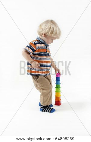 Child plays educational toy