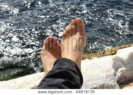 feet facing the sea