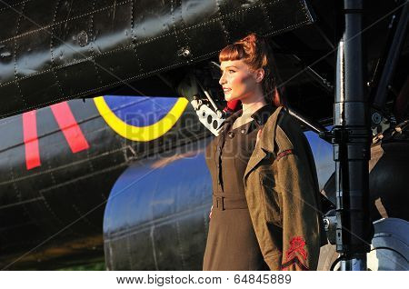 Pretty Lady In Army Uniform With Wwii Bomber