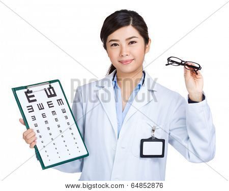 Female doctor holding eyechart and glasses