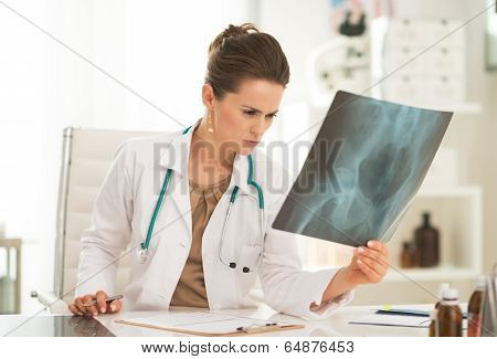 Medical Doctor Woman With Fluorography In Office