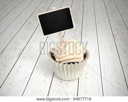 Gift Cupcake With Blank Chalkboard Signboard Label On White Wood