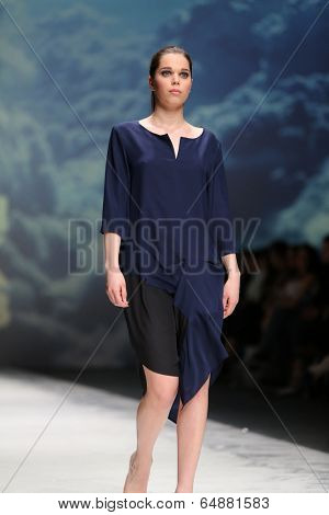 ZAGREB, CROATIA - MAY 09: Fashion model wearing clothes designed by Iva Karacic on the Zagreb Fashion Week on May 09, 2014 in Zagreb, Croatia.