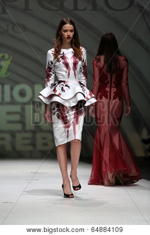 ZAGREB, CROATIA - MAY 09: Fashion model wearing clothes designed by Avaro Figlio on the Zagreb Fashion Week on May 09, 2014 in Zagreb, Croatia.