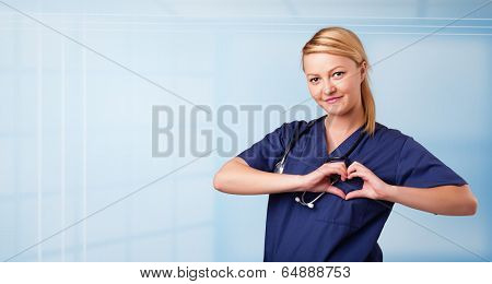 Pretty young nurse in hospital listening to empty copy space with sthetoscope